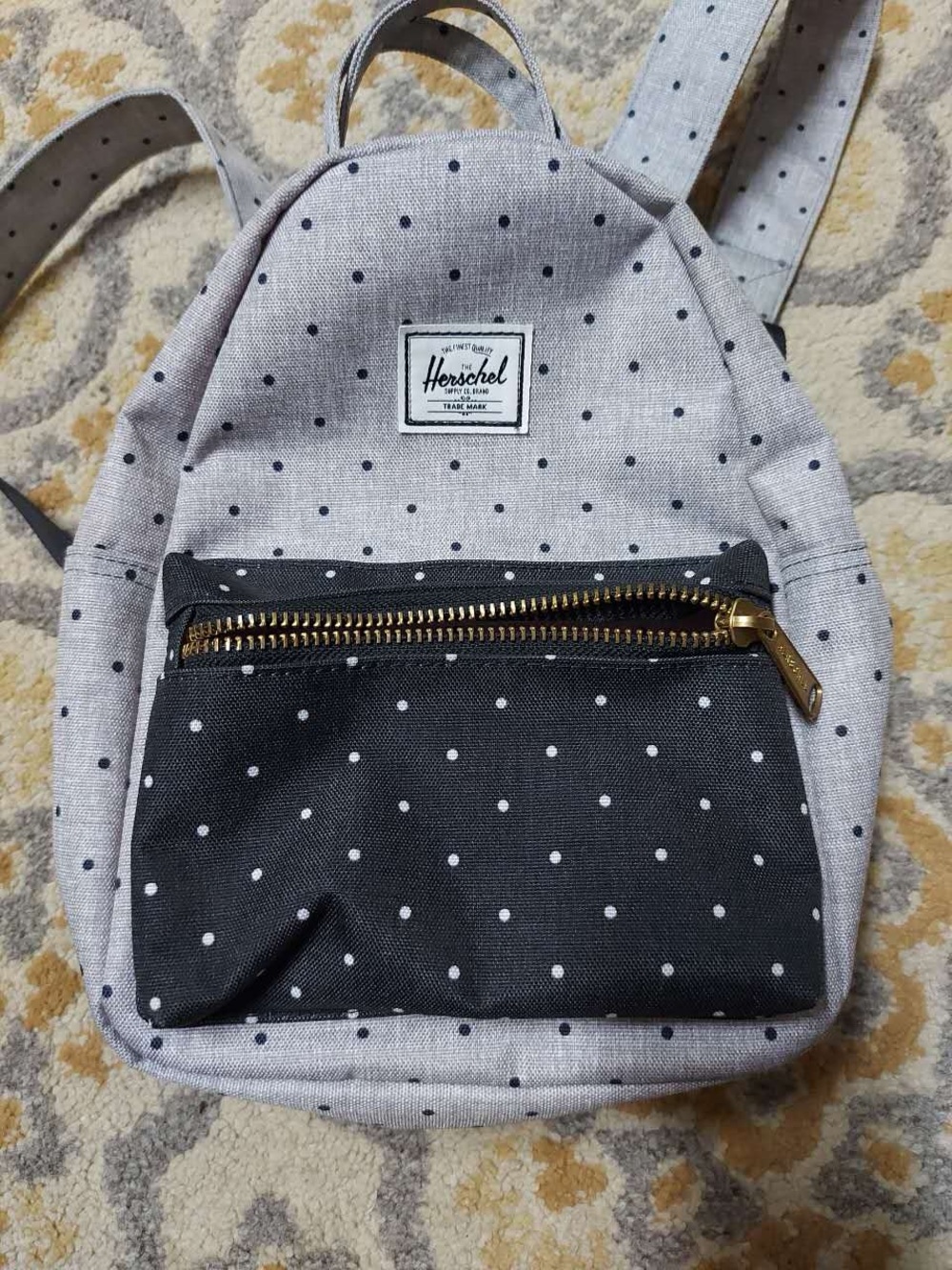 Herschel grey and black mini backpack with polka dots